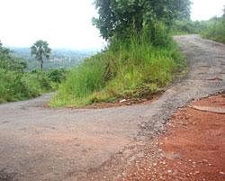 A dangerous hairpin bend on the dilapidated perimeter road of the Mangalore airport. DH photo