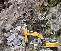 Members of Army's engineering wing ascend a landslide following Sunday's 6.9-magnitude earthquake in Phengla town, around 20 kilometers (12 miles) from Gangtok, in Sikkim. AP
