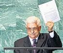 Palestinian President Mahmoud Abbas holds a letter requesting recognition of Palestine as a State as he addresses the 66th session of the United Nations General Assembly on Friday. AP