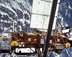 In this image provided by NASA this is the STS-48 onboard photo of the Upper Atmosphere Research Satellite (UARS) in the grasp of the RMS (Remote Manipulator System) during deployment, from the shuttle in September 1991. The satellite is 35 feet long, 15 feet in diameter, weighs 13,000 pounds. U.S. space officials say they expect a dead satellite to fall to Earth in about a week. NASA has been watching the 6-ton satellite closely. NASA scientists are doing their best to tell us where a plummeting 6-ton satellite will fall later this week. It's just that if they're off a little bit, it could mean the difference between hitting Florida or New York. Or, say, Iran or India. (AP