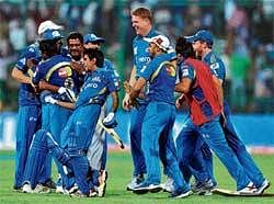 Team Work :Mumbai Indians celebrate their one-wicket win over Trinidad & Tobago in the Champions League on Monday. DH&#8200;photo/ Srikanta Sharma R