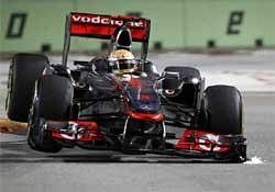 McLaren driver Lewis Hamilton of Britain steers his car during the third practice session on the Marina Bay City Circuit at the Singapore Formula One Grand Prix in Singapore. Hamilton is set to enthrall Bangaloreans on Tuesday. AP Photo.