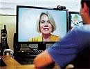 Marlene Maheu, a therapist, on computer screen, uses Skype to communicate remotely with a patient from her home in San Diego, USA. NYT