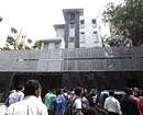 People gather outside Indian cricket player Sachin Tendulkar's new house in Bandra area which he moved into Wednesday in Mumbai, India on Wednesday. AP Photo
