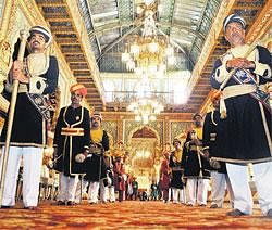 Glittering: Chowkidhars at the Khaas Darbar where the golden throne is worshipped by the scion of Mysore on the occasion of Dasara celebrations on Wednesday. DH Photo