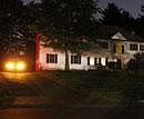 A police car sits in the driveway of the home of 26-year-old Rezwan Ferdaus, in Ashland, Mass., on Wednesday.  Ferdaus has been arrested and accused of plotting to destroy the Pentagon and the U.S. Capitol with large remote-controlled aircraft filled with explosives. AP