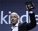 Amazon CEO Jeff Bezos holds up the new Kindle Fire at a news conference during the launch of Amazon's new tablets in New York, September 28, 2011. Reuters