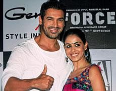 Bollywood actor John Abraham and Genelia D'Souza during promotional campaign for their new film 'Force' in Kolkata on Monday. PTI