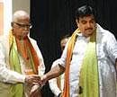 BJP President Nitin Gadkari with party senior leader L K Advani during party's National Executive Meeting in New Delhi on Friday. PTI