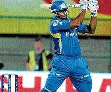 POWER-PACKED: Mumbai Indians Kieron Pollard smashes one over the fence during his blistering innings of 58 against Cape Cobras at the Chinnaswamy stadium in Bangalore on Friday. DH Photo/ Kishor Kumar Bolar