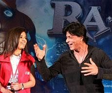 Bollywood Star Shahrukh Khan dances with a fan during an event to promote his new film Ra-One at Metro airport line, Shivaji stadium, in New Delhi on Wednesday. PTI