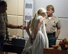 Actress Lindsay Lohan is handcuffed after a judge revoked her probation for failing to appear at a series of community service appointments at the Downtown Women's Shelter at Airport Branch Courthouse in Los Angeles October 19, 2011. Reuters