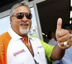 Force India team owner Vijay Mallya gives the thumb up at the end of the third practice session of the Italian F1 Grand Prix in Monza September 12, 2009.  Credit: Reuters