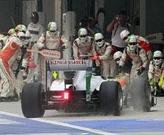 Force India driver Adrian Sutil of Germany steers his car to the pit during Indian Formula One Grand Prix at the Buddh International Circuit in Noida, 38 kilometers (24 miles) from New Delhi, India Sunday, Oct. 30, 2011. AP Photo