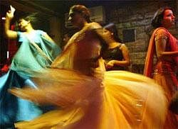 Bar girls perform at a dance bar in Bombay May 5, 2005. Reuters