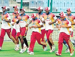 on a mission: West Indian players during a warm-up session at the Feroze Shah Kotla on Friday. AFP