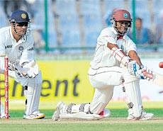 West Indies Shivnarine Chanderpaul essays a sweep en route to his unbeaten hundred against India on Sunday. AFP