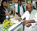 Trial: Farmers try organic food at a German stall set up at India Organic 2011- International Competence Centre for Organic Agriculture - organised by the Department of Agriculture at Palace Grounds in Bangalore on Thursday. DH Photo