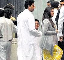 Aishwarya Rai-Bachchan along with Abhishek Bachchan  arrives at a hospital in Mumbai on Sunday evening. PTI