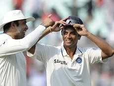 India's V.V.S.Laxman (L) and Rahul Dravid celebrate after winning on the fourth day of the second Test cricket match between Indian and West Indies at The Eden Gardens in Kolkata. AFP