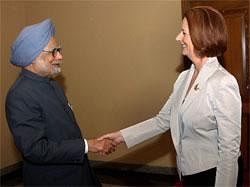 : Prime Minister Manmohan Singh with Australian counterpart Julia Gillard at a bilateral meeting in Bali, Indonesia on Saturday. PTI