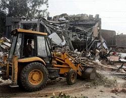 Haryana Urban Development Authority carrying out a demolition of unauthorised construction at Sikandarpur Market in Gurgaon on Monday. PTI Photo