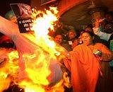 Lucknow: BJP leader Uma Bharti burn effigy of Walmart in Lucknow on Friday to register its protest against FDI in retail sector. PTI Photo