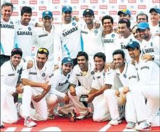 Indian team present a jubilant picture after bagging the Test series against the West Indies. AFP