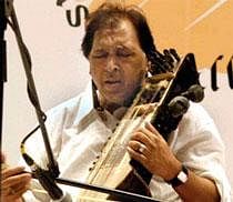 File Photo of Ustad Sultan Khan plays Sarangi in this file Photo. Khan passed away on Sunday. PTI Photo