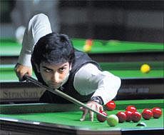 Focussed: Pankaj Advani looks to pot a black during his win over Egyptian Yaser Elsherbiny in the IBSF World Snooker Championship on Monday. DH Photo/ Kishor Kumar Bolar