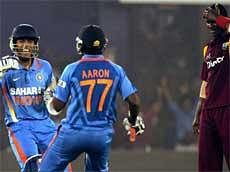 Indian batsmen V.Aaron and Umesh Yadav jubliate after India won the first one-dayer from West Indies in Cuttack on Tuesday.