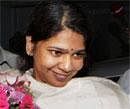 DMK MP Kanimozhi recieves a bouquet at her residence after her release from Tihar Jail in New Delhi on Tuesday. PTI Photo