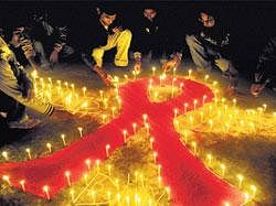 Lighting hopes: Students light candles during an HIV and Aids awareness campaign on the eve of World Aids Day in Agartala, Tripura, on Wednesday. PTI