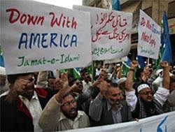 Supporters of Pakistani religious party Jamaat-i-Islami rally to condemn NATO airstrikes on Pakistani troops, on Friday, Dec 2, 2011 in Peshawar. (AP )