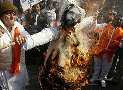 Supporters of the Hindu right wing party Shiv Sena burn an effigy of Mohammad Afzal Guru, the prime accused in the 2001 Parliament attack case, at a protest to mark the 10th anniversary of the attack in New Delhi.AP Photo