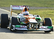 Sahara Force India Formula One team driver Paul di Resta from Britain drives the team's VJM05 car into the pit line during a test lap at the car's launch ahead of the forthcoming season at their base at the Silverstone Circuit near Silverstone, in England on Friday. AP Photo