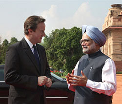 Prime Minister Manmohan Singh  with his British counterpart David Cameron. File Photo/PTI
