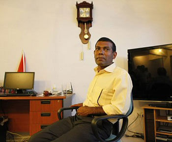 Former Maldives President Mohamed Nasheed meets the media at his residence in Male, Maldives, Thursday, Feb. 9, 2012. A Maldives court issued an arrest warrant Thursday for Nasheed, who resigned this week but later insisted he had been ousted by coup plotters in a political dispute that sparked rioting.AP Photo