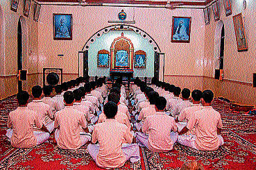 Students residing at Balakashram in Ramakrishna Math engaged in meditation at the Maths prayer hall.