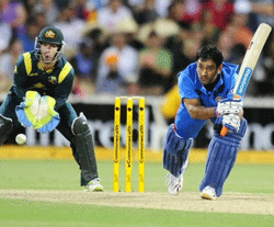 ndia's M.S. Dhoni, right, bats against Australia during their One Day International series cricket match in Adelaide. AP