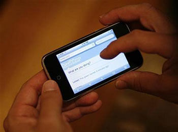 A Twitter page is displayed on an Apple iPhone in Los Angeles. Reuters File Photo