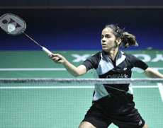 India's Saina Nehwal returns a shuttlecock to China's Wang Shixian during their women's singles final match at the Badminton Swiss Open tournament in the St. Jakobshalle in Basel, Switzerland, on Sunday. AP Photo