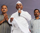 Anti-corruption activist Anna Hazare with his associates Arvind Kejriwal (R) and Manish Sisodia during his day long fast against corruption at Jantar Mantar in New Delhi on Sunday. PTI
