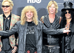 Guns N Roses, from left: Matt Sorum, Steven Adler, Duff McKagan and Slash appear in the press room after induction into the Rock and Roll Hall of Fame in Cleveland on Sunday. AP