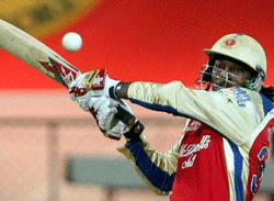Royal Challengers Bangalore's Chris Gayle plays a shot against Pune Warriors during IPL 5 match in Bengaluru on Tuesday. PTI
