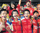 Spirited: Young fans showing their support for the RCB. DH Photos by Dinesh S.K