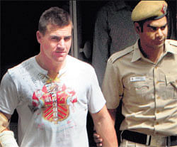 Luke Pomersbach being taken to court from Chanakyapuri Police Station in New Delhi on Friday. PTI