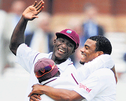 Joyous Windies Shannon Gabriel (right) celebrates with team-mates after dismissing England's Matt Prior. AP