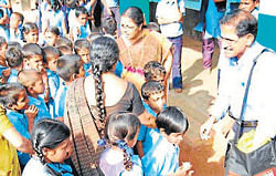 Jayaram Shriyan distributing nutritious food to the students of Angaragundi Government Composite High School, at Baikampady near Surathkal.