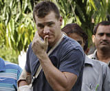 Australian cricketer Luke Pomersbach comes out of a court after being granted bail in New Delhi on Saturday. AP